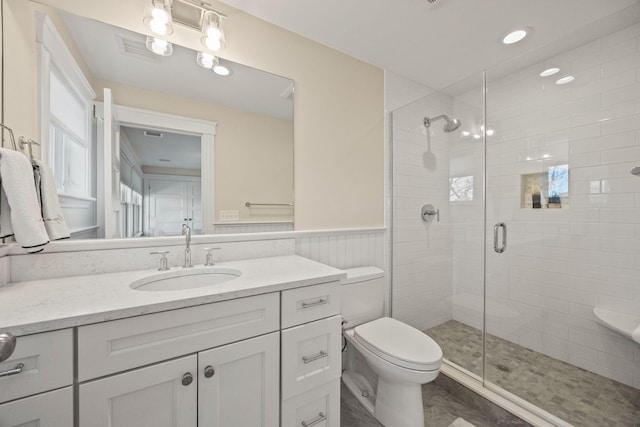 20 Chase St, West Harwich, MA 02671 - bathroom featuring a shower stall, vanity, toilet, and wainscoting