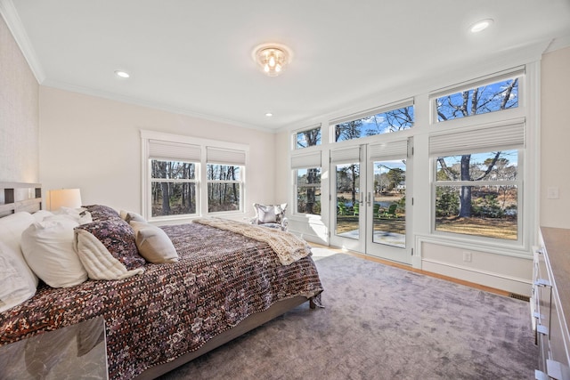 bedroom with access to exterior, crown molding, and french doors