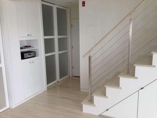 535 Commercial St Unit U1, Provincetown, MA 02657 - stairway featuring wood finished floors