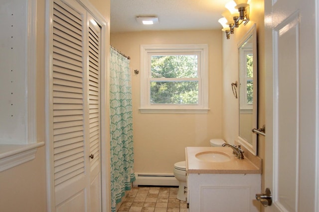 103 Braeside Rd, West Falmouth, MA 02540 - bathroom featuring a closet, a baseboard heating unit, toilet, and vanity