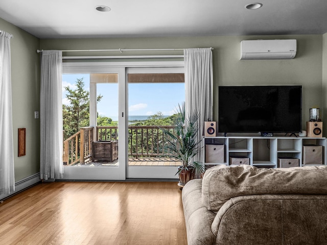 50 View Crest Dr, Falmouth, MA 02540 - living area featuring a wall unit AC, wood finished floors, and recessed lighting