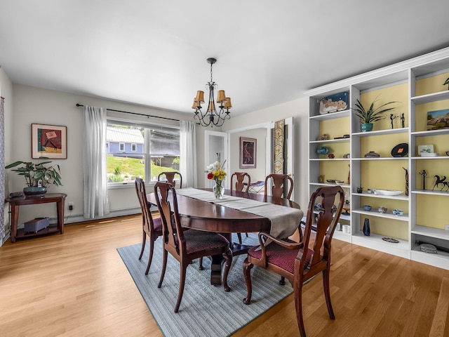 50 View Crest Dr, Falmouth, MA 02540 - dining area featuring a chandelier and light wood-style flooring