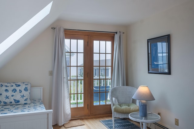 99 Shore Blvd Unit A, East Sandwich, MA 02537 - living area with a skylight, light wood finished floors, and lofted ceiling