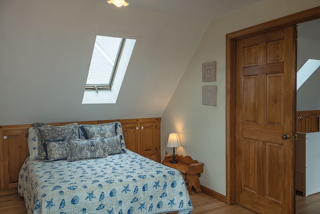 99 Shore Blvd Unit A, East Sandwich, MA 02537 - bedroom with a skylight, light wood-style floors, vaulted ceiling, and baseboards