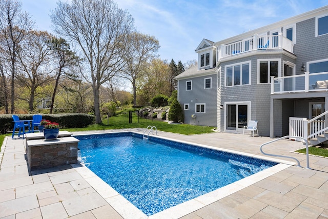 view of pool featuring a patio area and fence