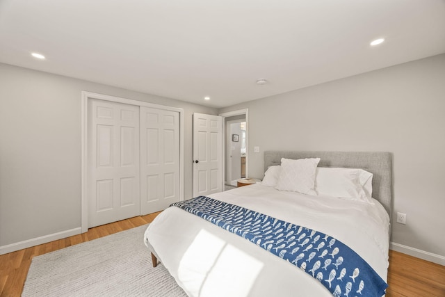 bedroom featuring a closet and wood-type flooring