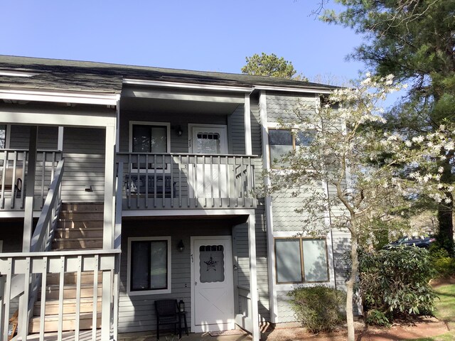 view of front of property with a balcony