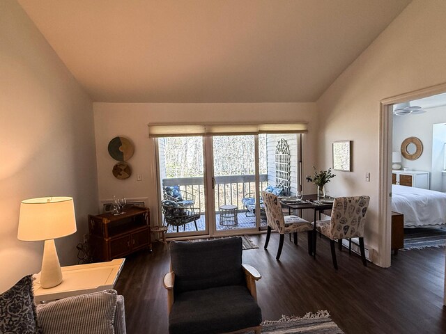 living room featuring wood finished floors and lofted ceiling
