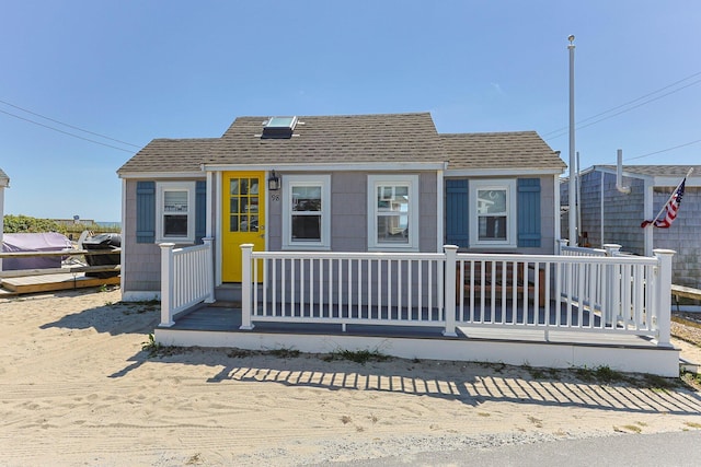 view of front of house with a shingled roof