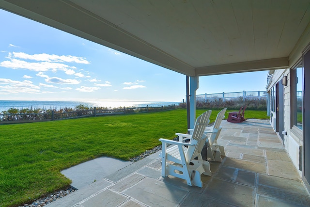 view of patio with a water view