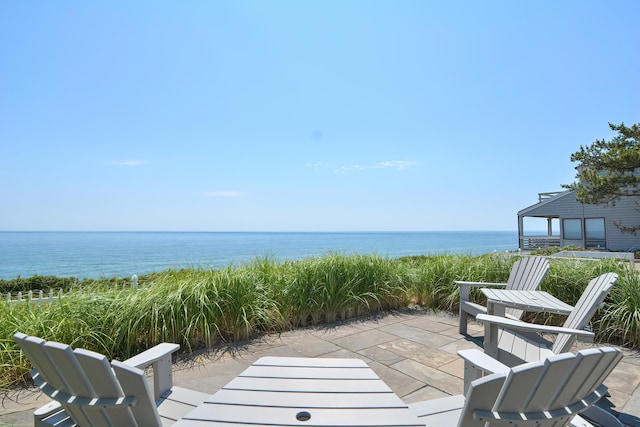 view of patio with a water view