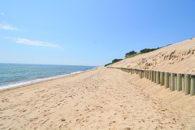 property view of water featuring a beach view