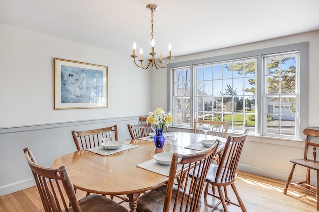 14 Trinity Cv, West Harwich, MA 02671 - dining room featuring light wood-type flooring and a chandelier