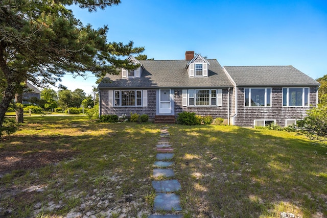 14 Trinity Cv, West Harwich, MA 02671 - cape cod house featuring a chimney, a front yard, and a shingled roof