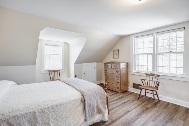14 Trinity Cv, West Harwich, MA 02671 - bedroom with wood finished floors, multiple windows, and lofted ceiling