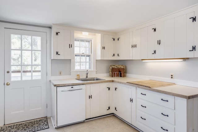 14 Trinity Cv, West Harwich, MA 02671 - kitchen with dishwasher, healthy amount of natural light, and white cabinetry