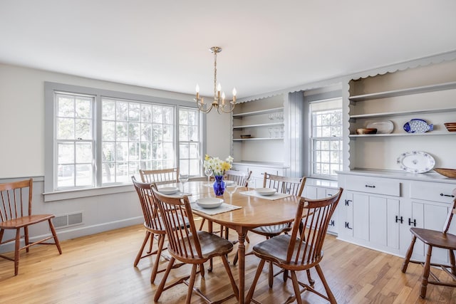 14 Trinity Cv, West Harwich, MA 02671 - dining room featuring light wood-style floors and a chandelier