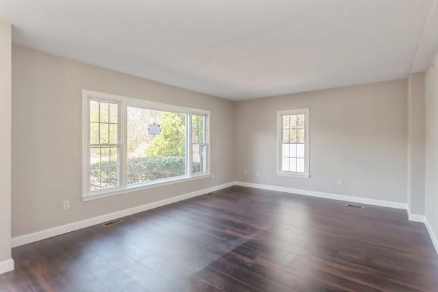 20 Yankee Dr, Brewster, MA 02631 - unfurnished room with baseboards and dark wood-style flooring