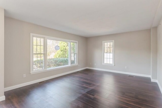 20 Yankee Dr, Brewster, MA 02631 - spare room featuring healthy amount of natural light, baseboards, and dark wood-type flooring