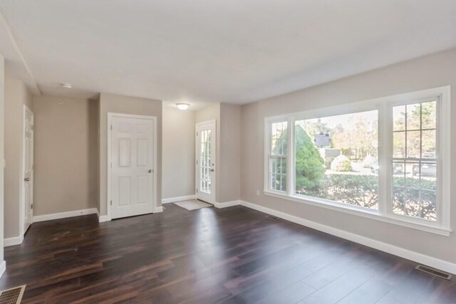 20 Yankee Dr, Brewster, MA 02631 - unfurnished room with baseboards and dark wood-type flooring