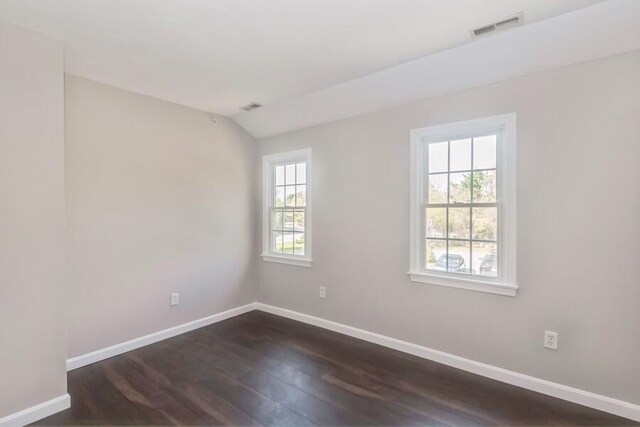 20 Yankee Dr, Brewster, MA 02631 - unfurnished room featuring baseboards, dark wood-style floors, and vaulted ceiling