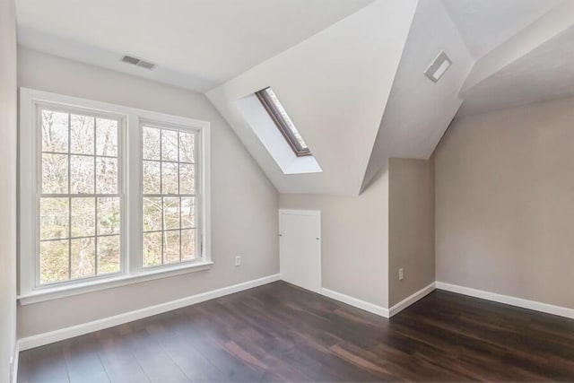 20 Yankee Dr, Brewster, MA 02631 - additional living space with a skylight, lofted ceiling, dark wood finished floors, and baseboards