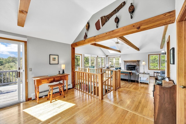 3 Amber Way, Truro, MA 02666 - living area with a brick fireplace, light wood-style floors, ceiling fan, baseboard heating, and a skylight