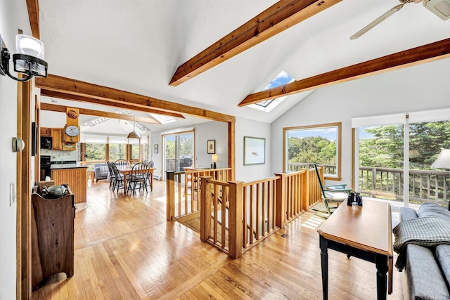 3 Amber Way, Truro, MA 02666 - living room featuring beamed ceiling, light wood finished floors, a skylight, and high vaulted ceiling