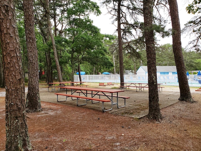 310 Old Chatham Rd Unit H-12, South Dennis, MA 02660 - surrounding community featuring view of wooded area and a pool