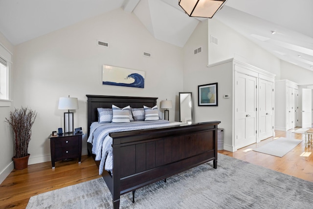29 Point St, Provincetown, MA 02657 - bedroom featuring wood finished floors, high vaulted ceiling, beam ceiling, and baseboards