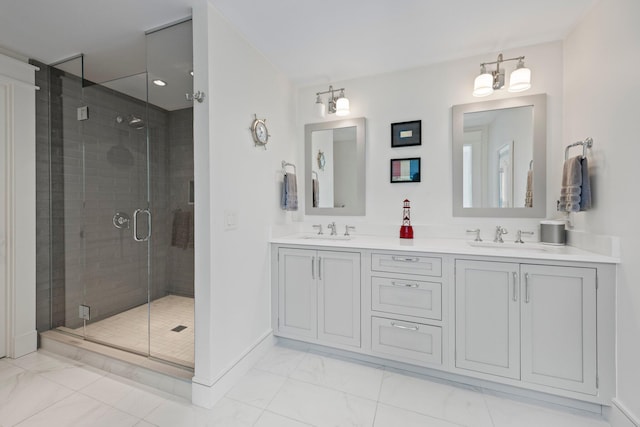 29 Point St, Provincetown, MA 02657 - bathroom with marble finish floors, double vanity, a shower stall, and baseboards