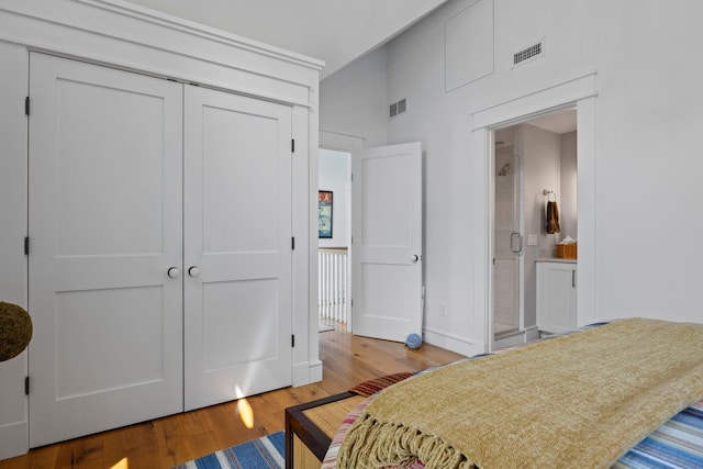 29 Point St, Provincetown, MA 02657 - bedroom featuring wood finished floors, a closet, and ensuite bath