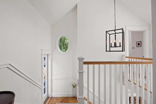 29 Point St, Provincetown, MA 02657 - stairs with a chandelier, high vaulted ceiling, and wood finished floors