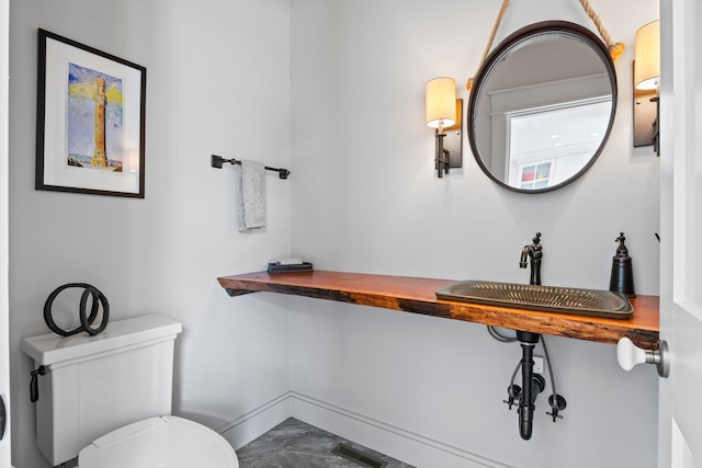 29 Point St, Provincetown, MA 02657 - bathroom featuring toilet, a sink, and baseboards