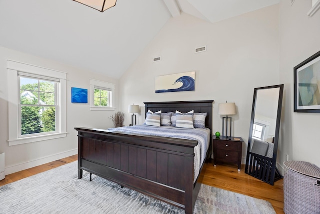 29 Point St, Provincetown, MA 02657 - bedroom featuring wood finished floors, beamed ceiling, high vaulted ceiling, and baseboards