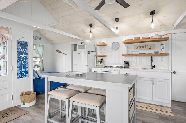241 Old Wharf Rd Unit 90, Dennis Port, MA 02639 - kitchen featuring open shelves, white appliances, a sink, wood finished floors, and wooden ceiling