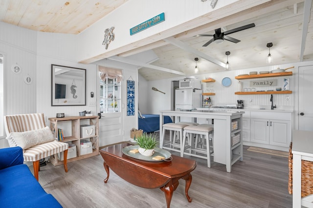 241 Old Wharf Rd Unit 90, Dennis Port, MA 02639 - living area with light wood-type flooring, wooden ceiling, and ceiling fan