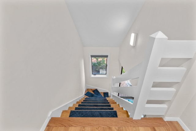 stairs with lofted ceiling