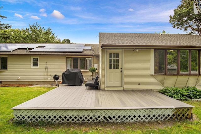 298 Oakland Rd, Hyannis, MA 02601 - back of house featuring a wooden deck, solar panels, a lawn, and roof with shingles