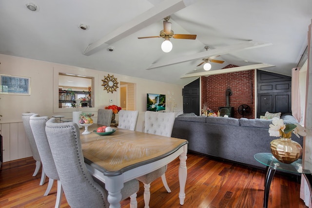 298 Oakland Rd, Hyannis, MA 02601 - dining area with a wood stove, wood finished floors, and ceiling fan