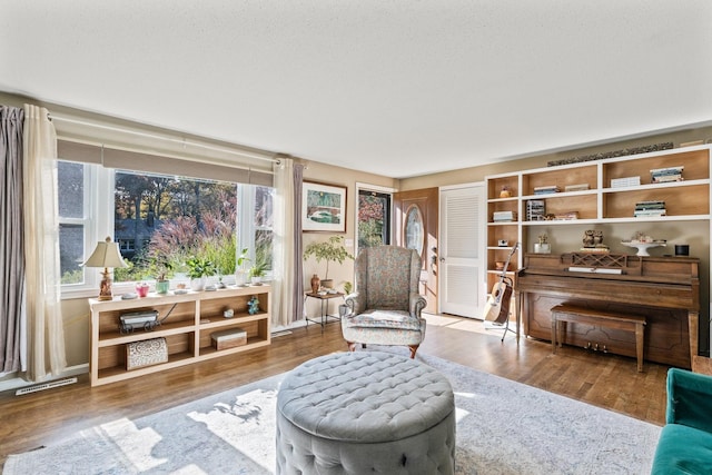 sitting room featuring wood-type flooring