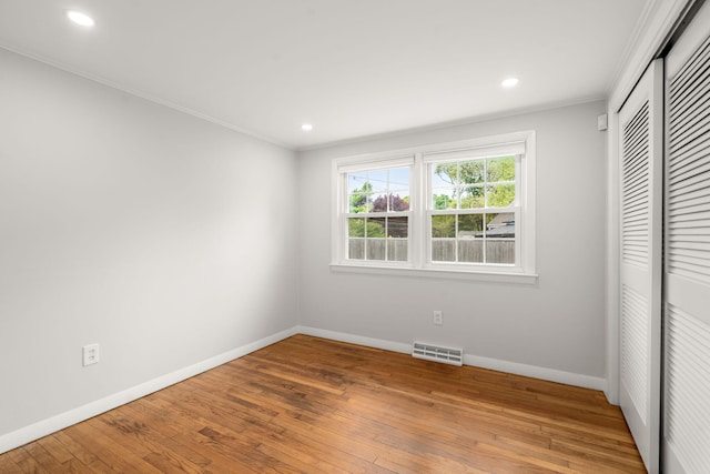 6 Harrington Way, Hyannis, MA 02601 - unfurnished bedroom featuring crown molding, baseboards, hardwood / wood-style floors, recessed lighting, and a closet