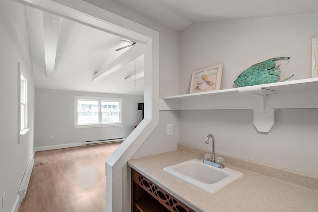 6 Harrington Way, Hyannis, MA 02601 - bar featuring a sink, baseboard heating, lofted ceiling, light wood-style floors, and a ceiling fan