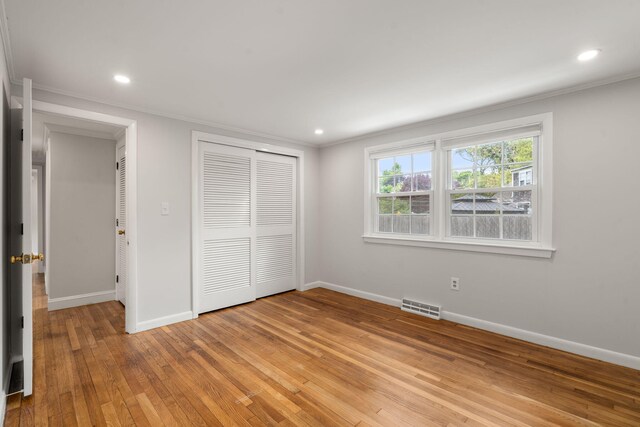 6 Harrington Way, Hyannis, MA 02601 - unfurnished bedroom featuring crown molding, baseboards, light wood finished floors, a closet, and recessed lighting