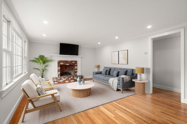 6 Harrington Way, Hyannis, MA 02601 - living area with wood finished floors, baseboards, recessed lighting, a fireplace, and crown molding