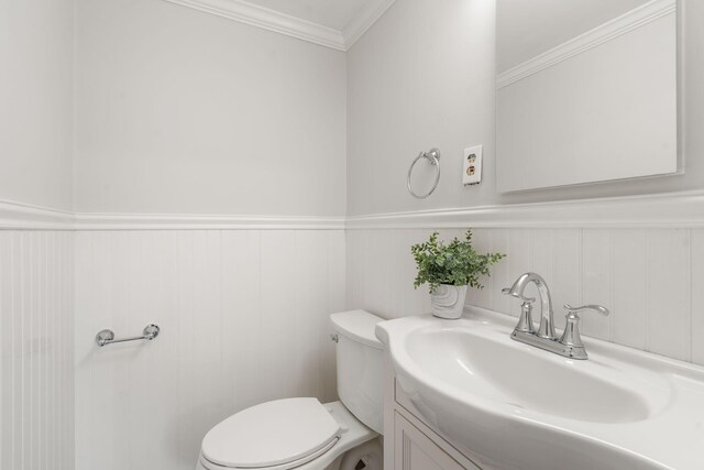 6 Harrington Way, Hyannis, MA 02601 - half bath featuring toilet, wainscoting, vanity, and ornamental molding