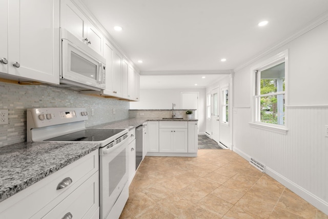 6 Harrington Way, Hyannis, MA 02601 - kitchen featuring white appliances, crown molding, backsplash, white cabinetry, and recessed lighting