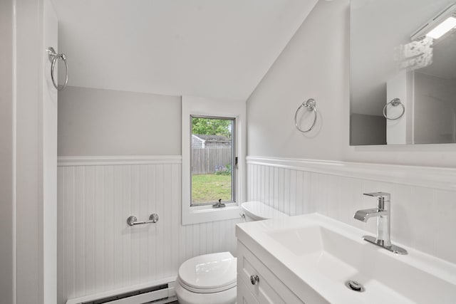 6 Harrington Way, Hyannis, MA 02601 - half bath with a baseboard radiator, a wainscoted wall, lofted ceiling, toilet, and vanity