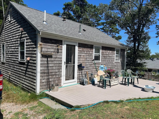 rear view of property with a wooden deck