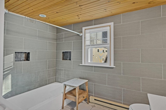 bathroom featuring tile walls, a baseboard heating unit, a washtub, toilet, and wooden ceiling